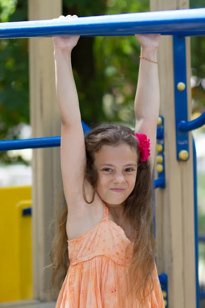 Little girl playing on the playground — Stock Photo, Image