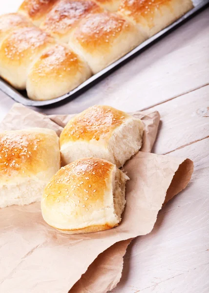 Fresh homemade bread rolls with sesam seed on table — Stock Photo, Image