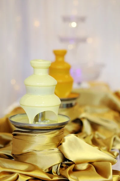 Delicious white chocolate fondue fountain — Stock Photo, Image