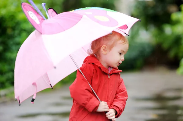 Adorable girl at rainy day in autumn — Stock Photo, Image