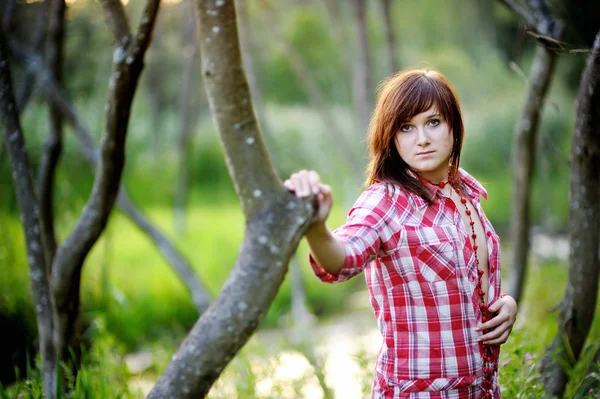 Young beautiful woman at a sunset — Stock Photo, Image