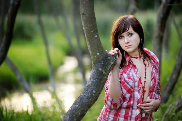 Young beautiful woman at a sunset — Stock Photo, Image