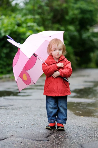 Adorable toddler girl at rainy day in autumn — Stock Photo, Image