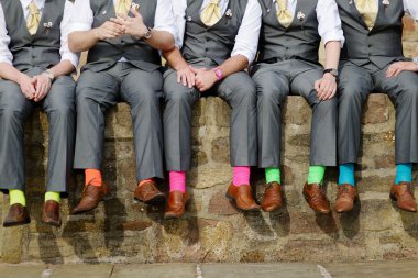 Colorful socks of groomsmen clipart