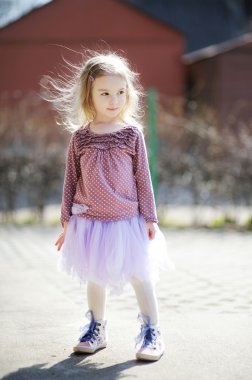 Adorable girl having fun on spring