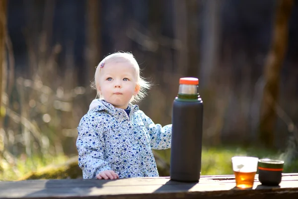 Adorable toddler girl camping