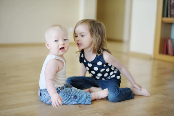 Two sisters playing together Stock Picture