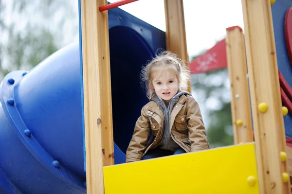 Adorable girl having fun on a playground Stock Image