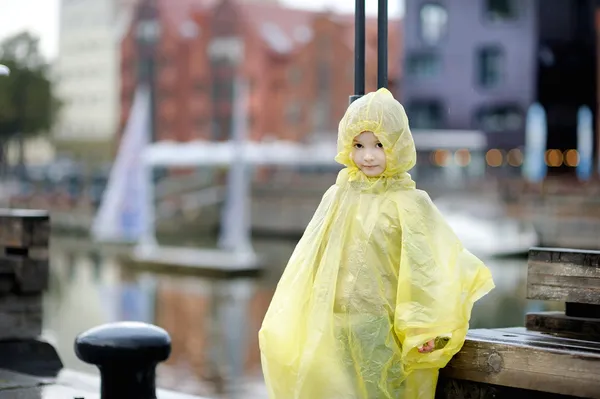 Adorable little girl in a rain coat — Stock Photo, Image