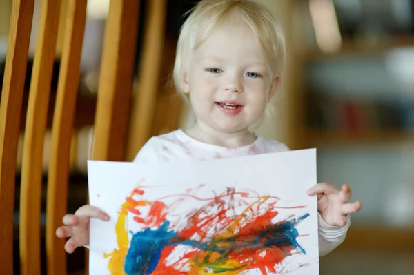 Little toddler girl displaying her picture — Stock Photo, Image