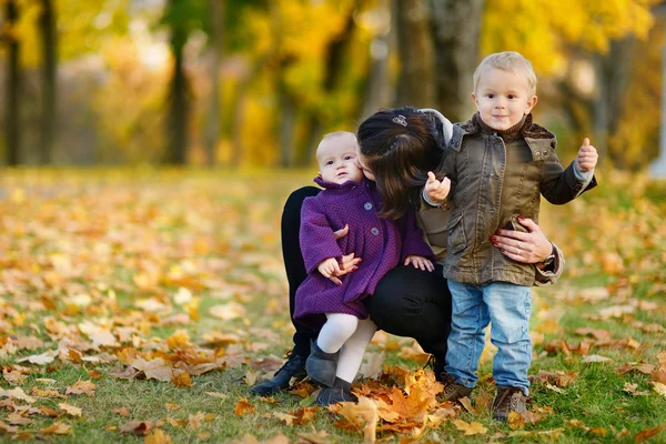 Happy family on beautiful autumn day — Stock Photo, Image