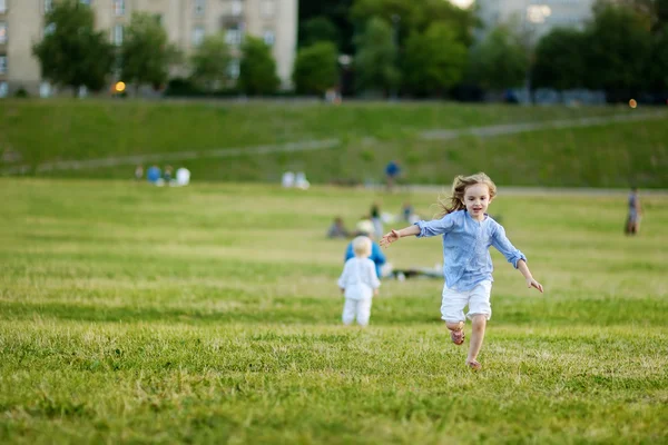 Adorable girl running around outdoors — Stock Photo, Image