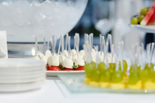 Plates with assorted snacks — Stock Photo, Image