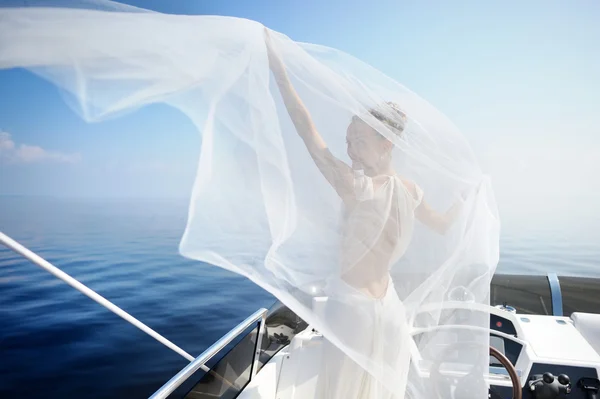 Happy bride on a yacht — Stock Photo, Image