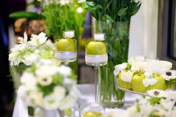 Beautiful bouquet of green apples and a candles — Stock Photo, Image