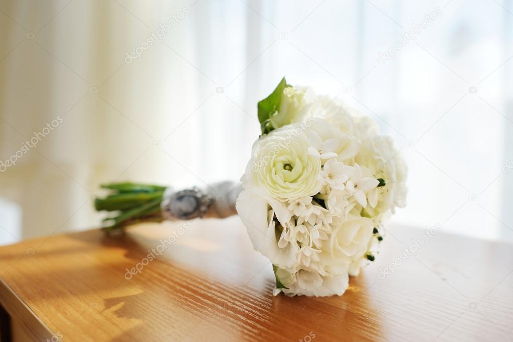 Beautiful wedding bouquet laying on a table