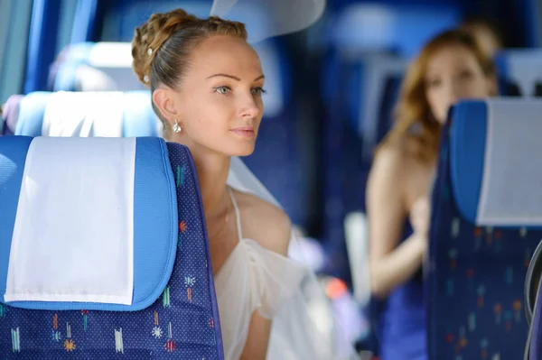 Beautiful young bride portrait in a bus — Stock Photo, Image