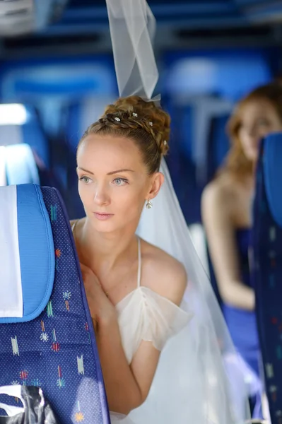 Beautiful young bride portrait in a bus — Stock Photo, Image