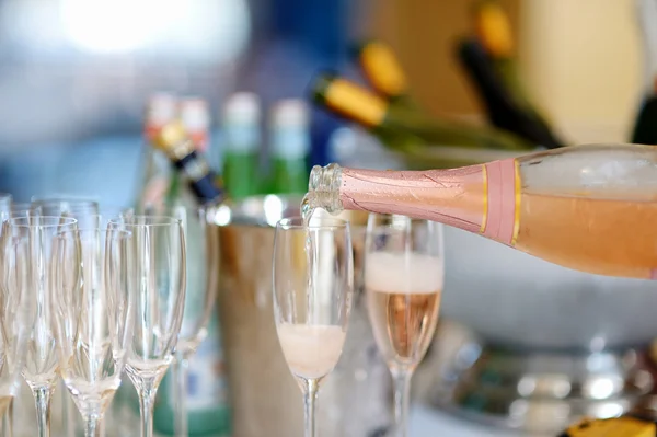 Pouring champagne into a glasses — Stock Photo, Image