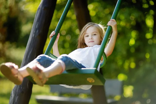 Adorable girl having fun on a swing — Stock Photo, Image