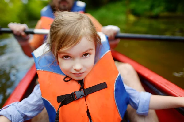 Little girl and her father on a kayak — Stock Photo, Image