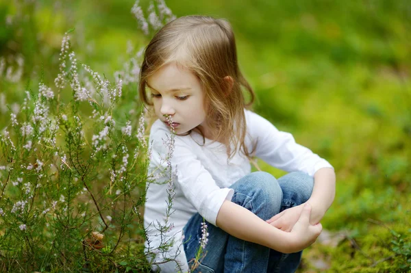 Adorable little girl hiking in the forest — Stock Photo, Image