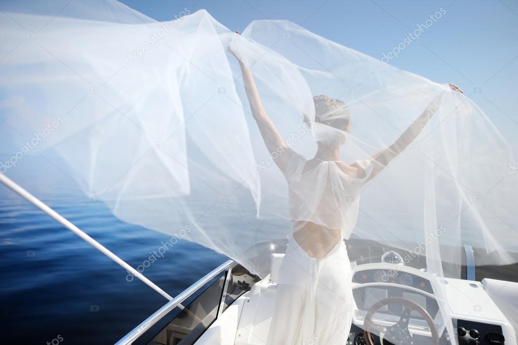 Happy bride on a yacht