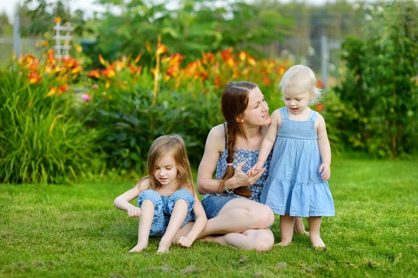 Mother and her little daughters — Stock Photo, Image