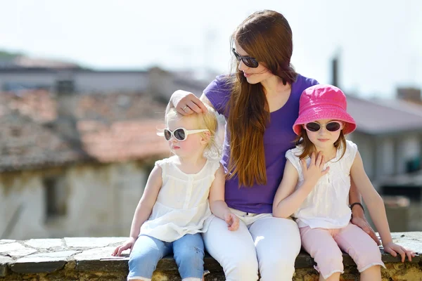 Cute little sisters and   mother — Stock Photo, Image