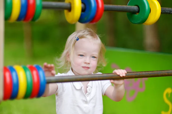 Chica en el parque infantil —  Fotos de Stock