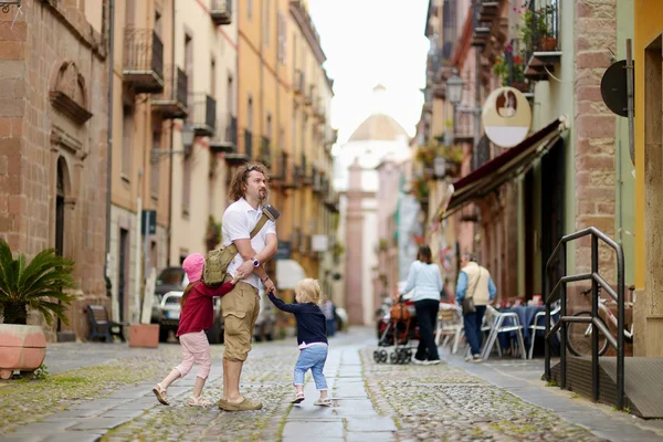 Little sisters and   father — Stock Photo, Image