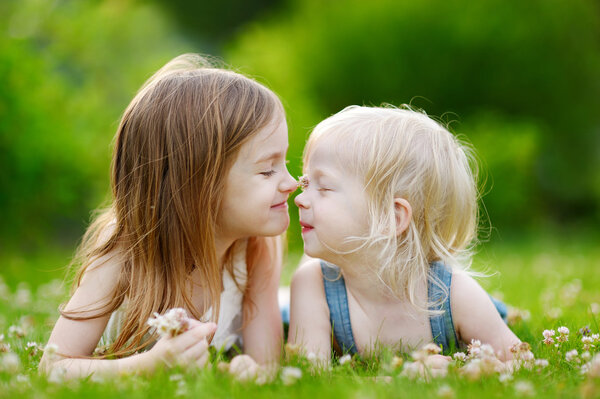 Sisters on grass