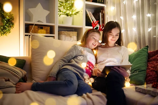 Two Cute Young Sisters Using Tablet Home Warm Cozy Living — Stock Photo, Image