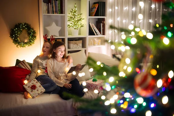 Two Cute Young Sisters Using Tablet Home Warm Cozy Living — Stock Photo, Image