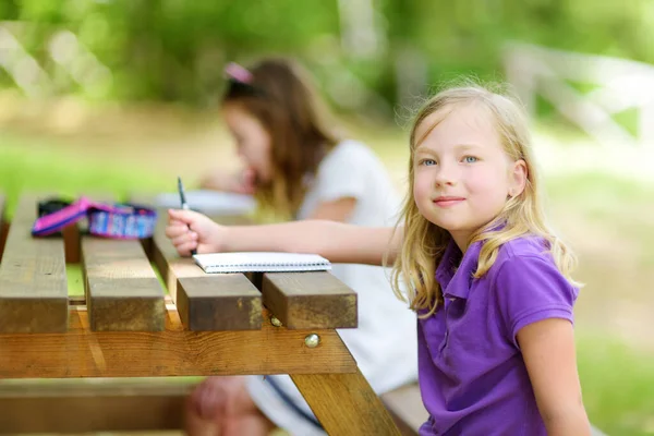 Two Happy Sisters Drawing Together Wooden Table Outdoors Little Girls — Stock Photo, Image