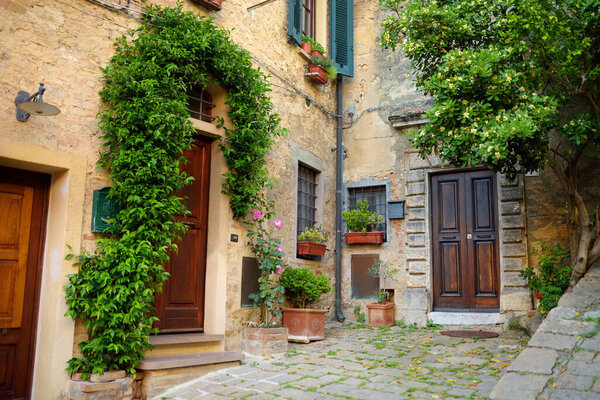 Charming old streets of Volterra, known fot its rich Etruscan heritage, located on a high hill overlooking the picturesque landscape. Tuscany, Italy.