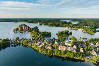 Aerial view of Trakai Island Castle and its surroundings, located in Trakai town, Lithuania. Beautiful view from the above on summer sunset.