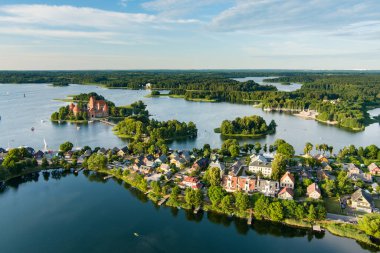 Aerial view of Trakai Island Castle and its surroundings, located in Trakai town, Lithuania. Beautiful view from the above on summer sunset. clipart