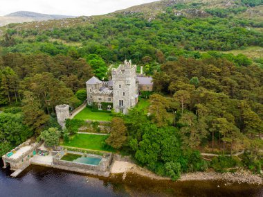 Aerial view of Glenveagh Castle, a large castellated mansion located in Glenveagh National Park. Glenveagh National Park, the second largest national park in Ireland, County Donegal, Ireland clipart