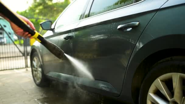 Young Man Using Water Gun Wash His Car Male Driver — 图库视频影像