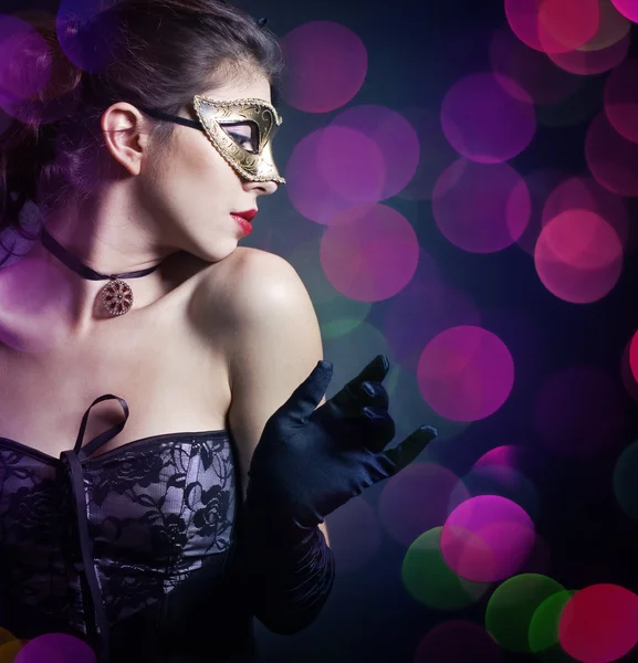 Elegant woman in a mask — Stock Photo, Image