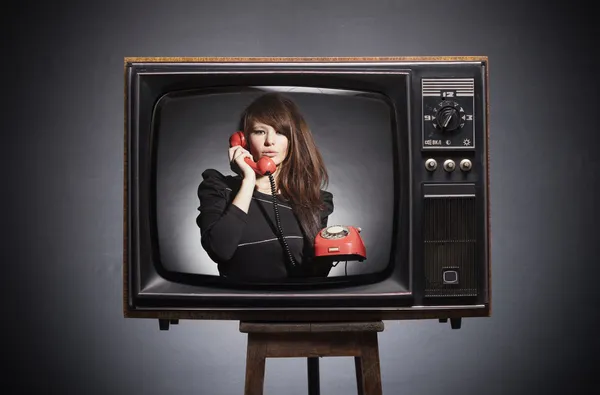 Retro TV on the screen says the young woman in a retro phone.