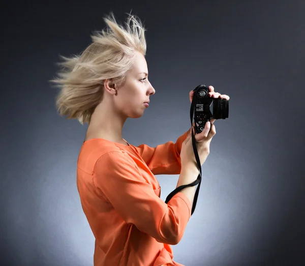 Girl c with flying hair photographing — Stock Photo, Image