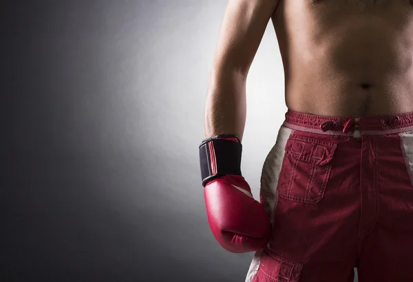 Boxeador con un guante Fotos De Stock