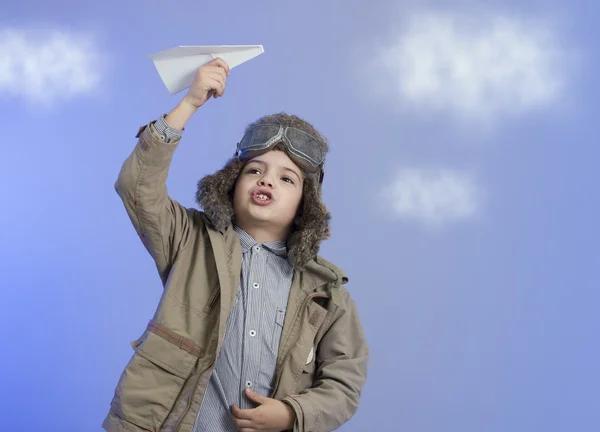 Little boy with a paper airplane. — Stock Photo, Image