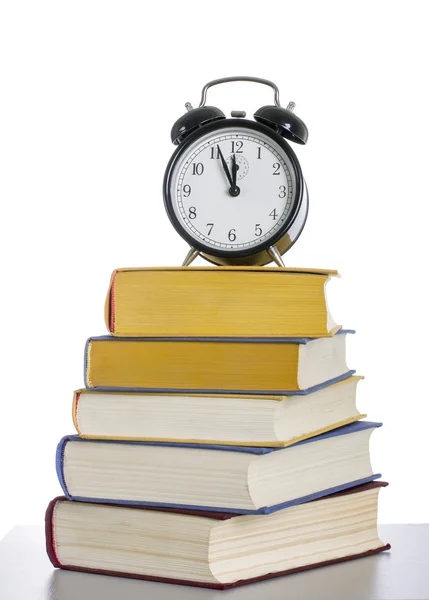 Stack of books with an alarm clock — Stock Photo, Image