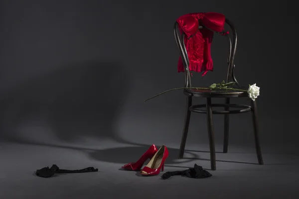 Sexy lingerie white rose on a retro chair. — Stock Photo, Image