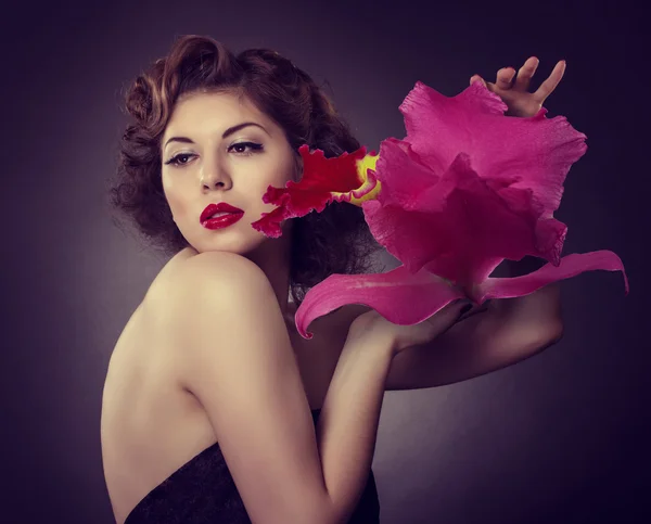 Woman with a big red flower — Stock Photo, Image