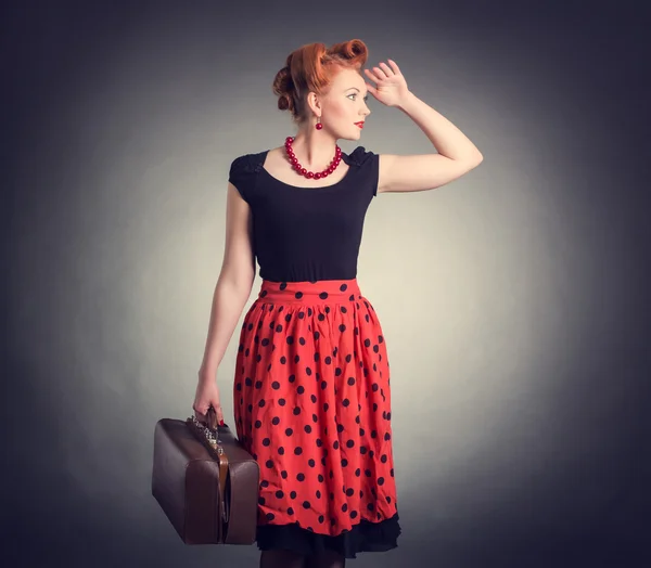 Woman with a suitcase in a retro style — Stock Photo, Image