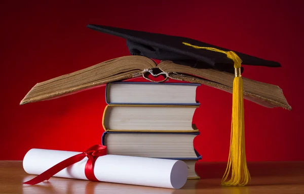 Mortarboard and graduation scroll — Stock Photo, Image